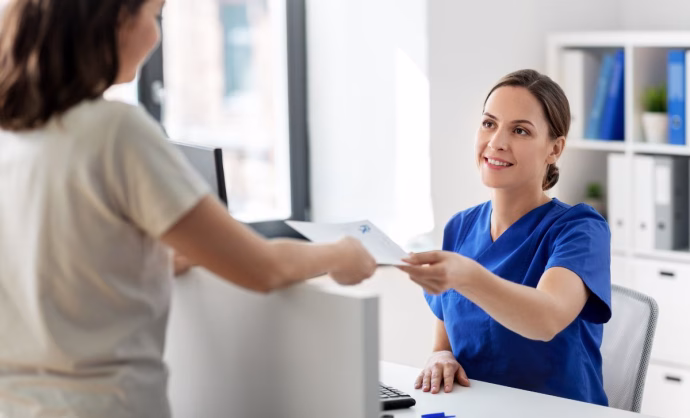 foreign woman applying for a health card from a female employee's wife
