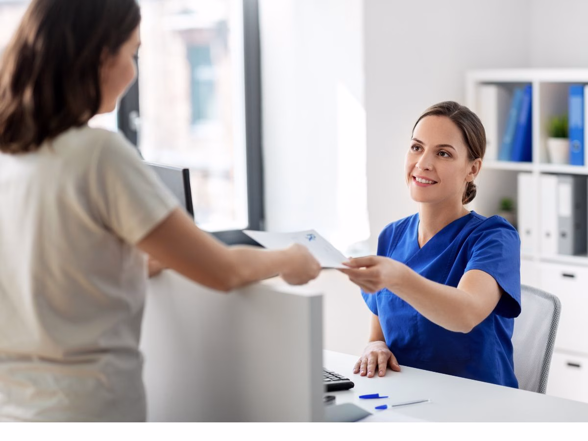 foreign woman applying for a health card from a female employee's wife