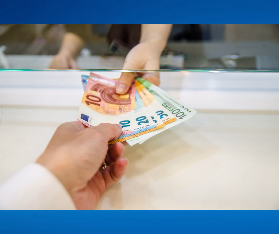 Hand of person handing money to another person